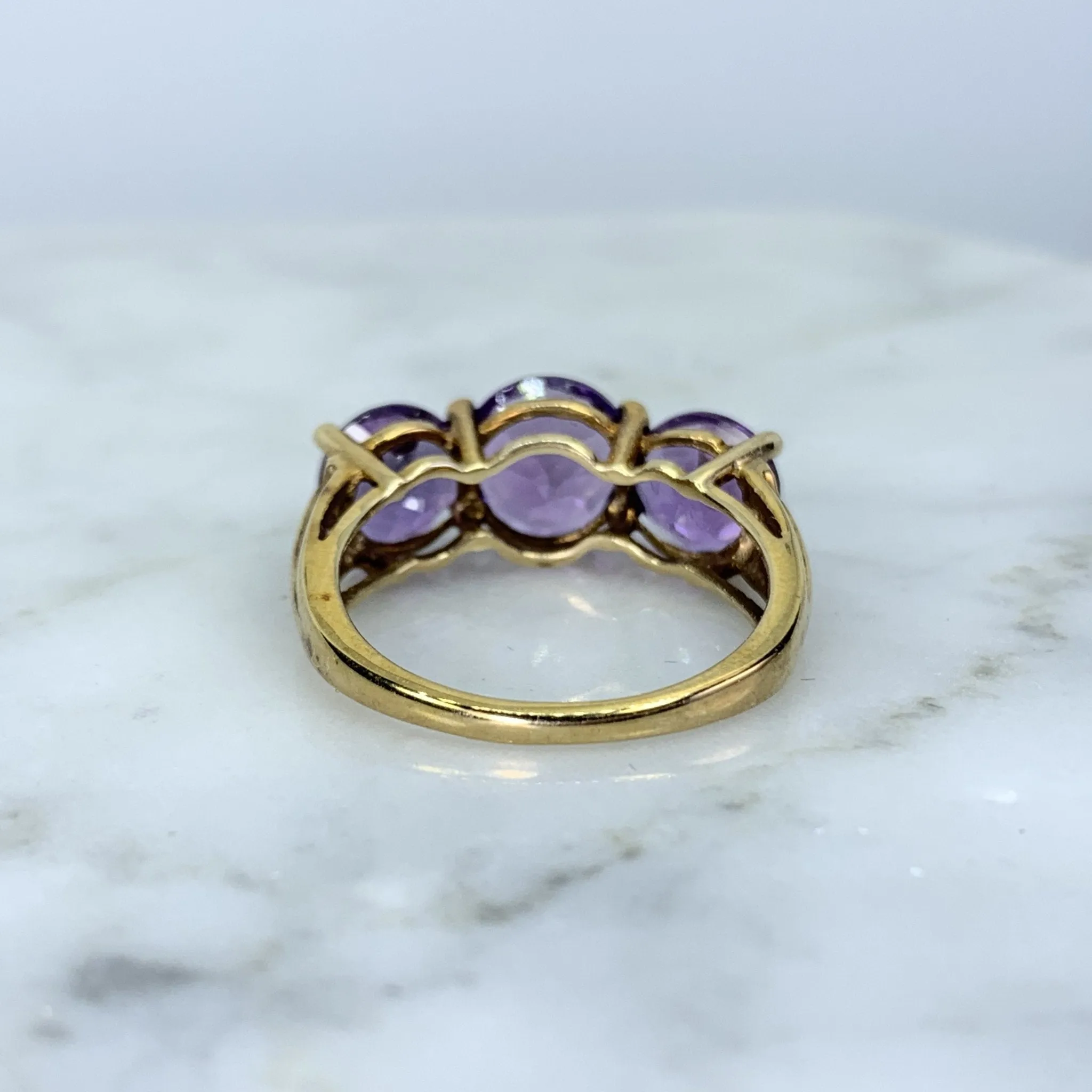 1970s Amethyst Ring with Three Bright Purple Gemstones set in Yellow Gold. February Birthstone.