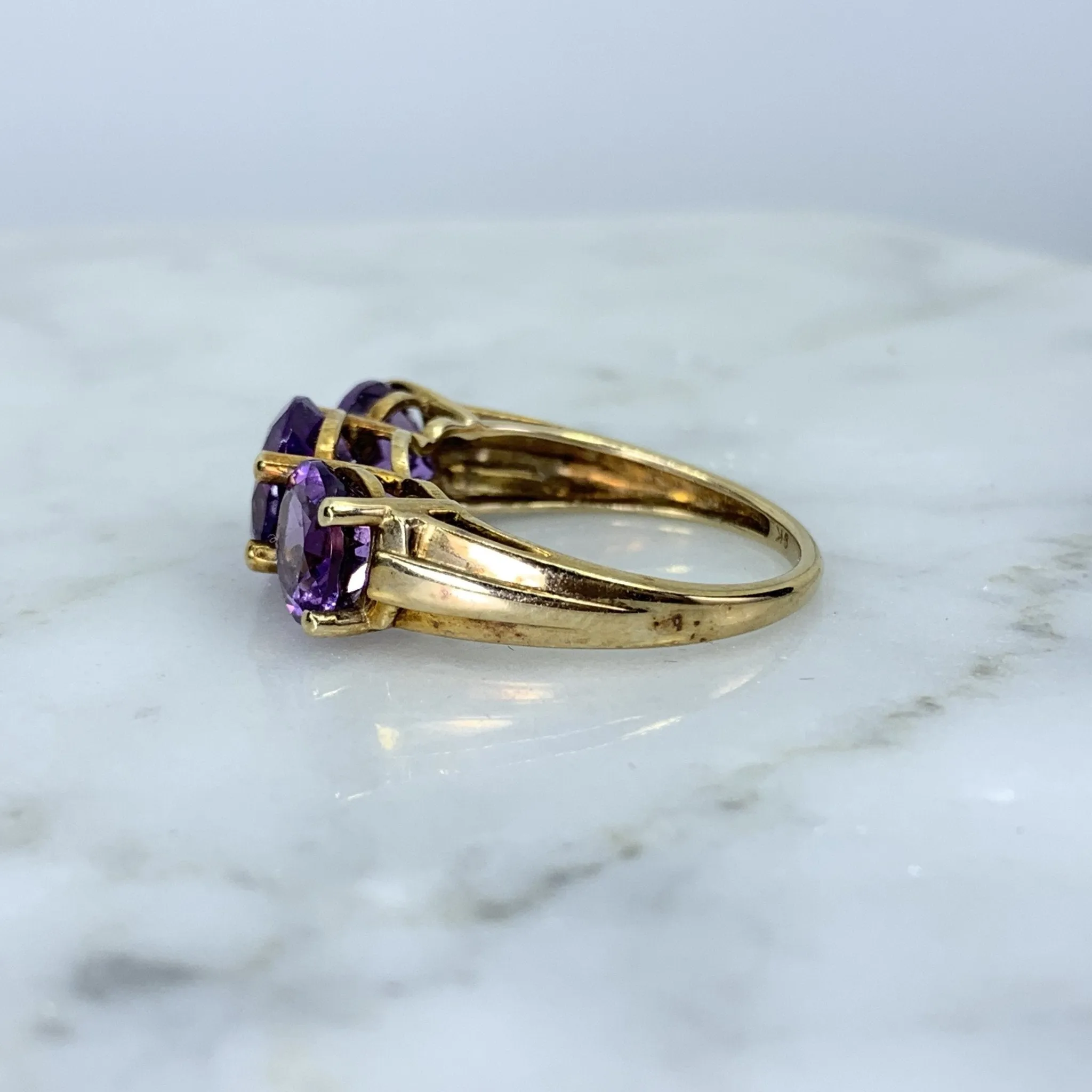 1970s Amethyst Ring with Three Bright Purple Gemstones set in Yellow Gold. February Birthstone.