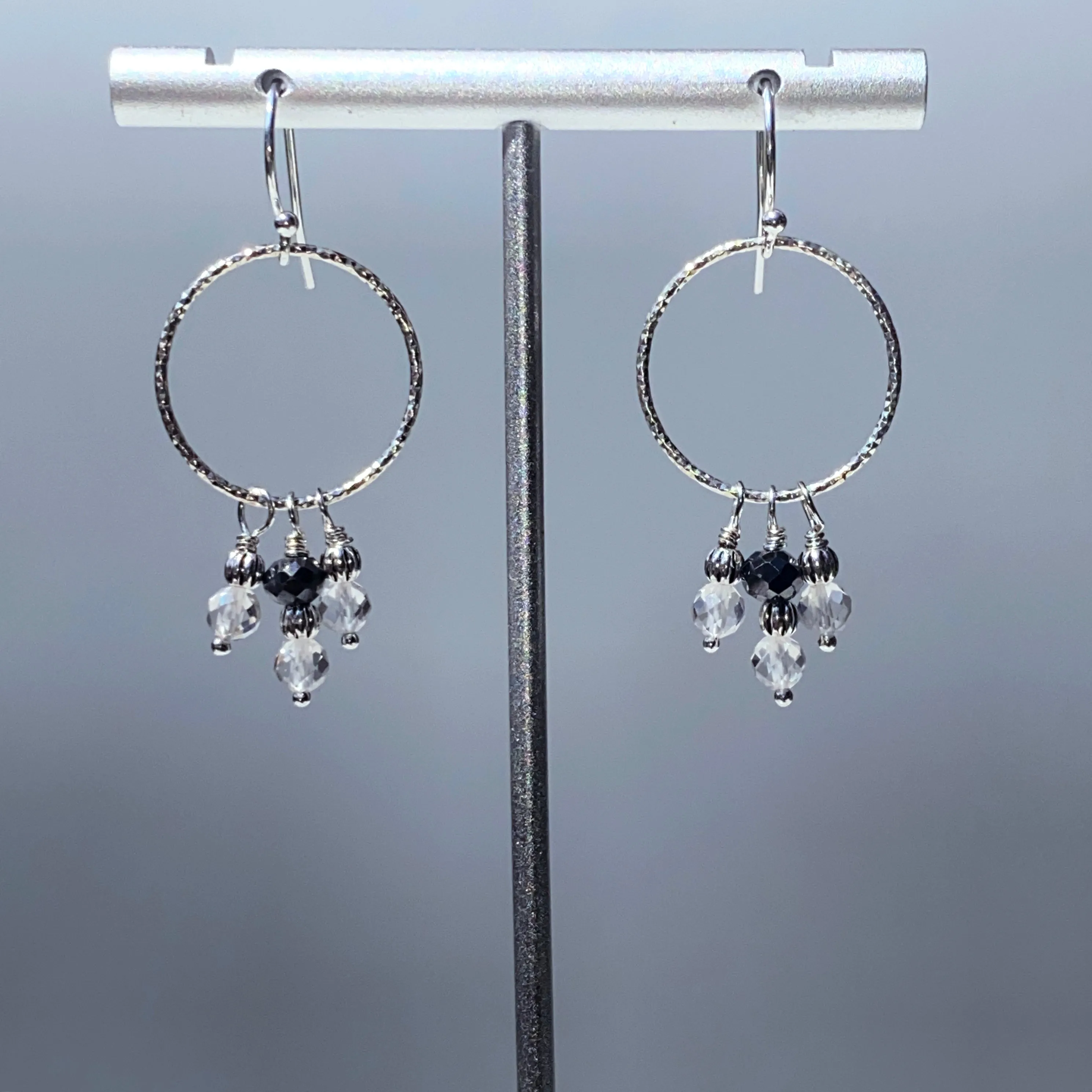 Black diamond, white topaz gemstones, and and sterling silver dangle earrings