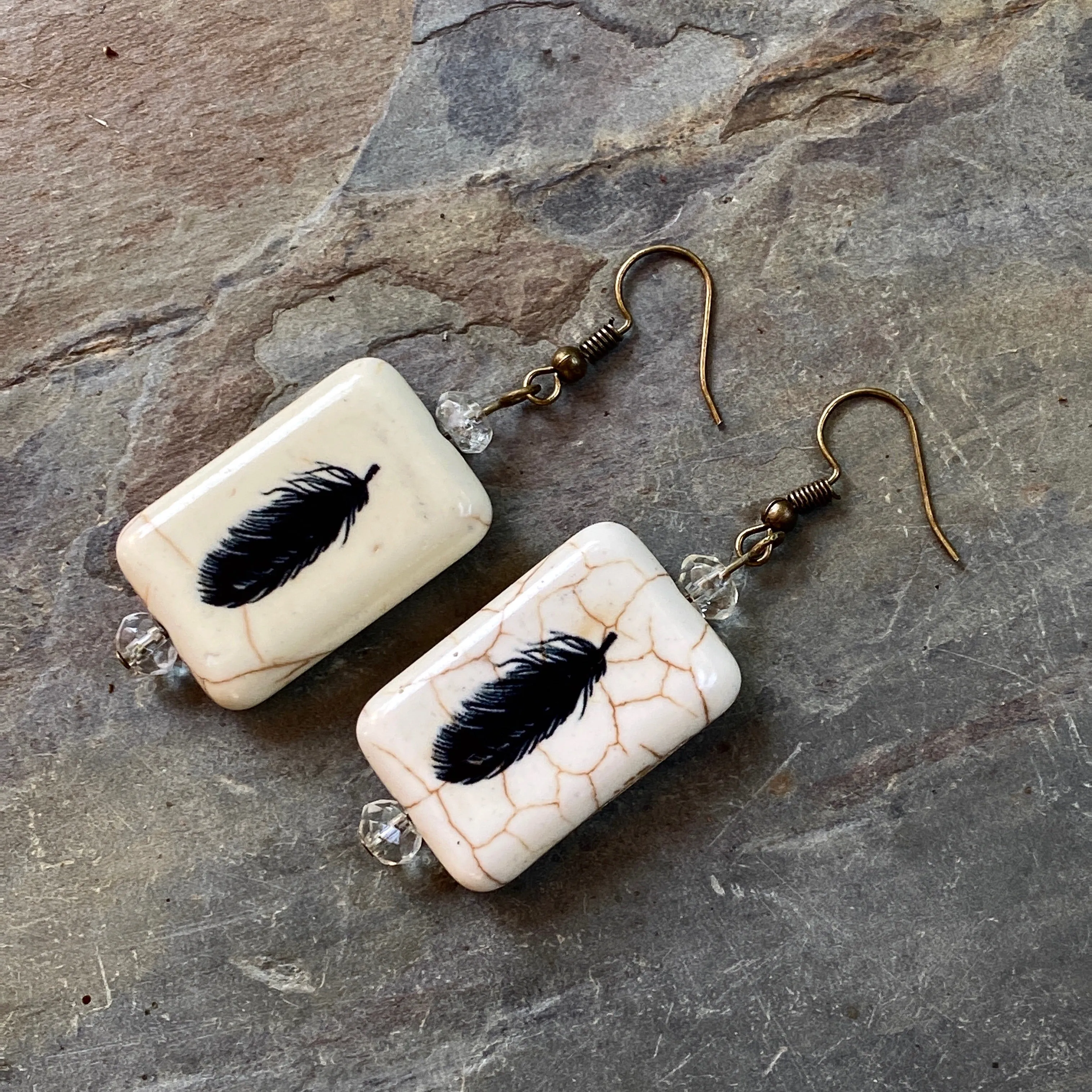 Painted Feather earrings with citrine gemstones.