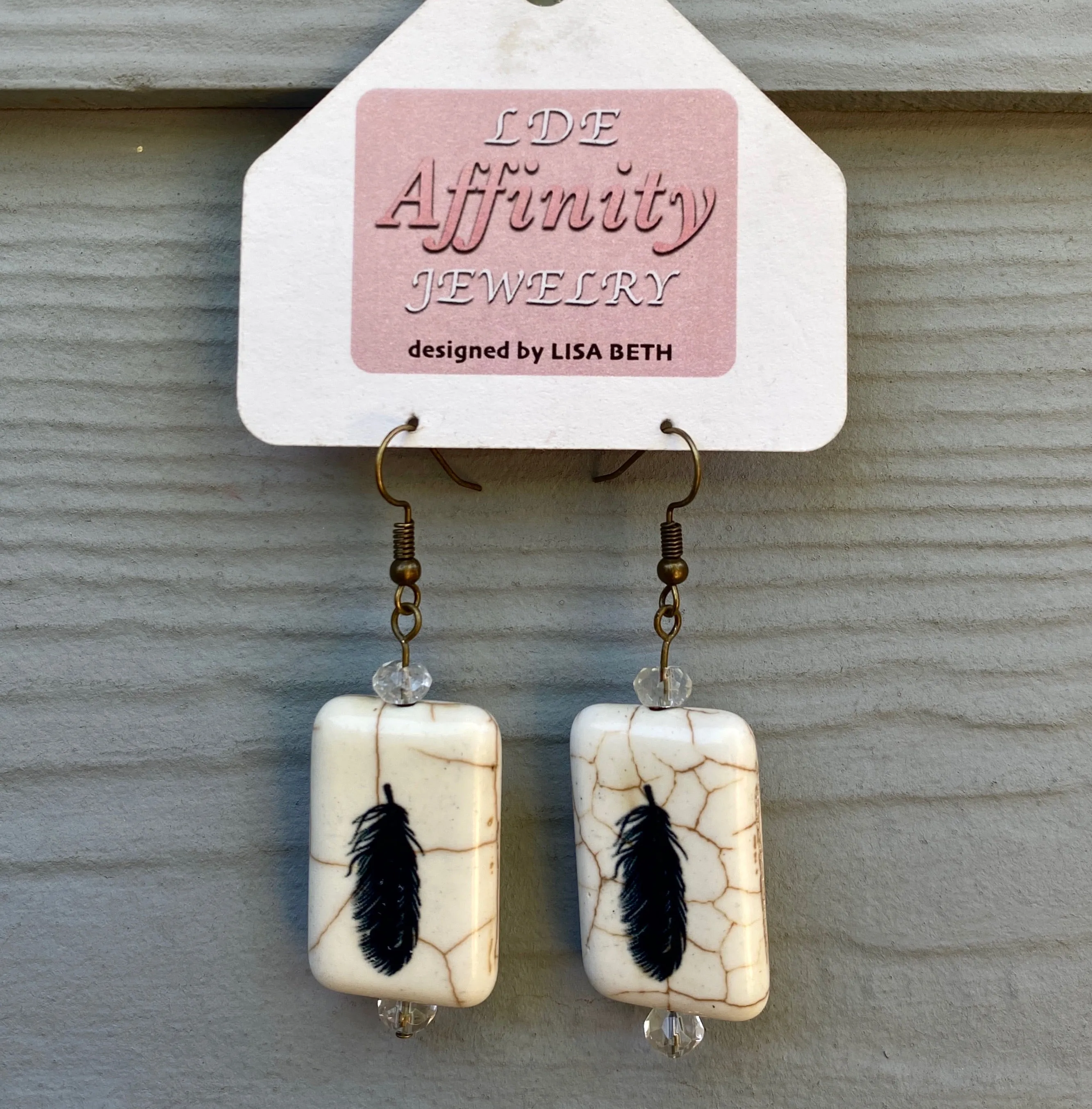 Painted Feather earrings with citrine gemstones.