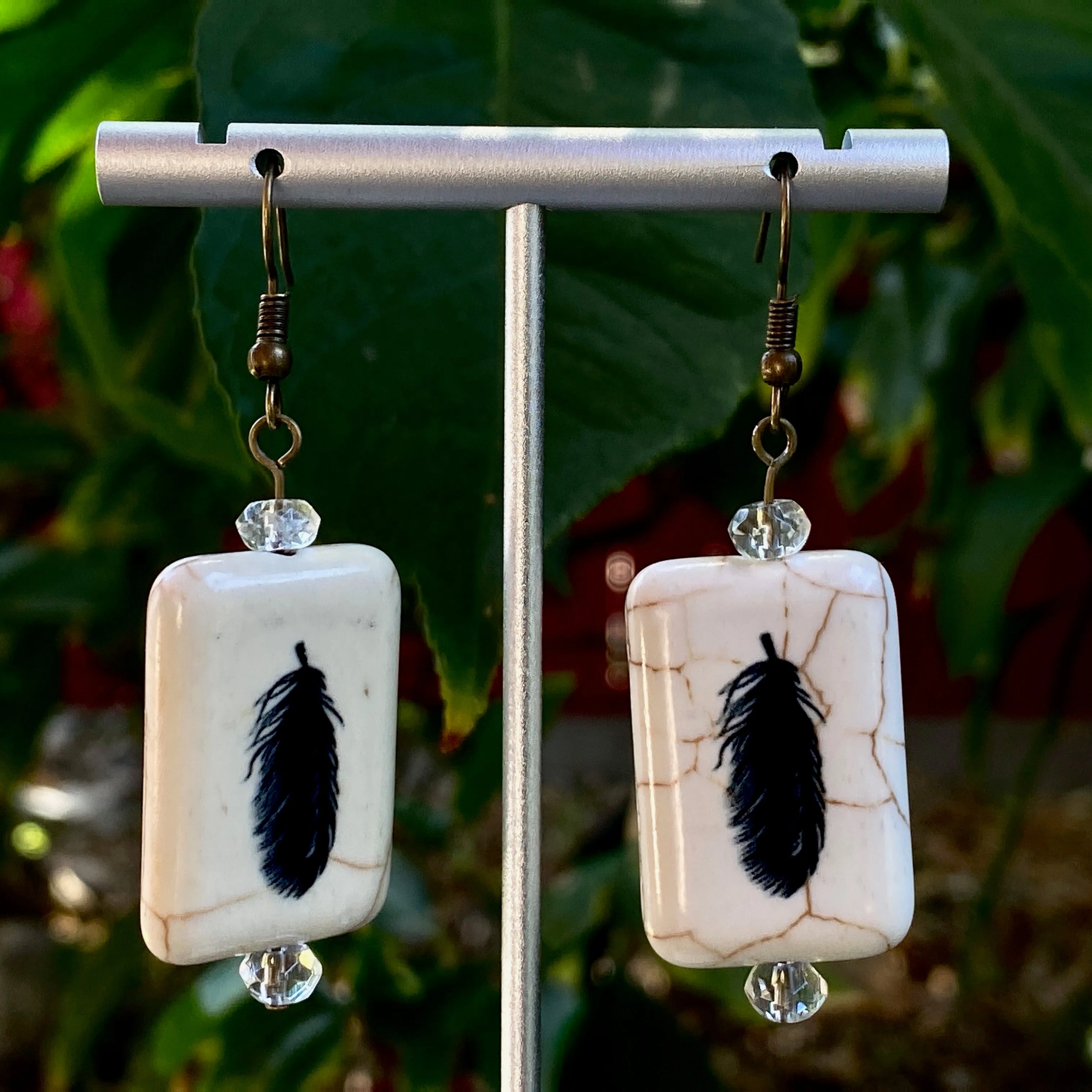 Painted Feather earrings with citrine gemstones.